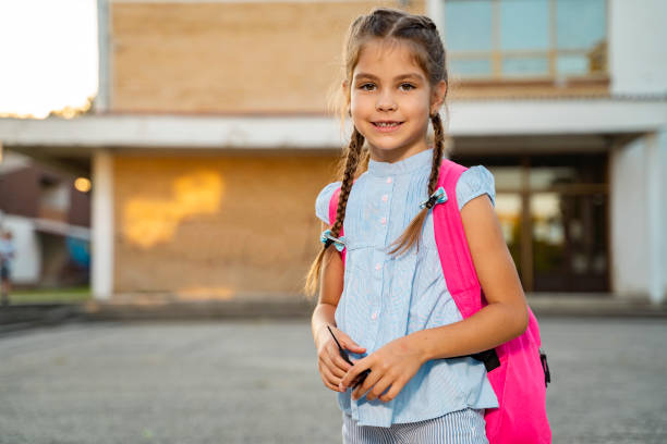 istock Cute girl going to elementary school, standing 1271228320
