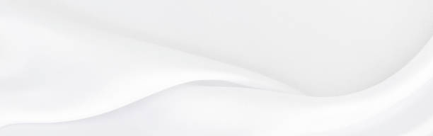 istock White gray satin texture that is white silver fabric silk panoramic background with beautiful soft blur pattern natural. 1271228324