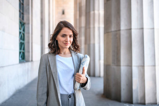istock Smiling Caucasian Female Law Student Carrying Book 1271229397