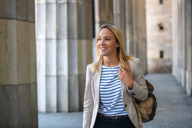 istock Smiling Female Law Student Walking with Backpack 1271229426