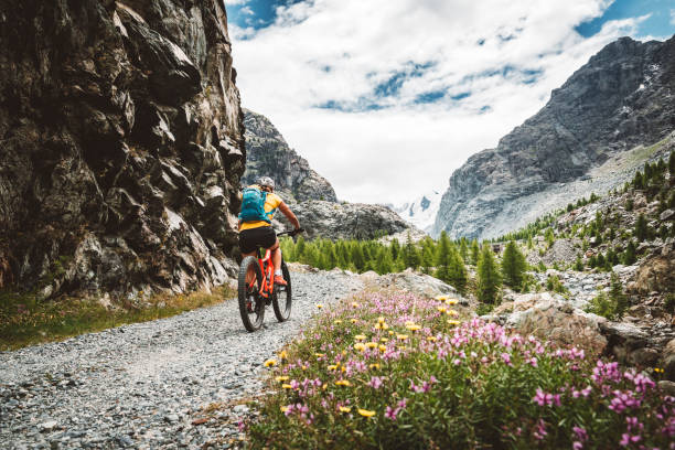istock Woman mountain biking in Zermatt, Switzerland 1271229607