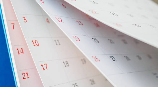 istock Calendar page flipping sheet close up on office table background business schedule planning appointment meeting concept 1271230186