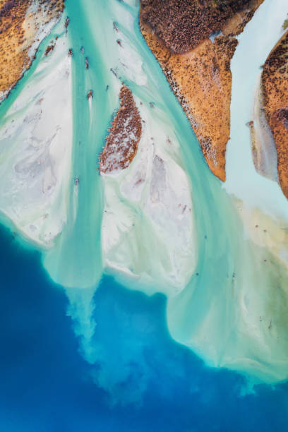 istock Colorful texture of river flowing into Lake. 1271230727