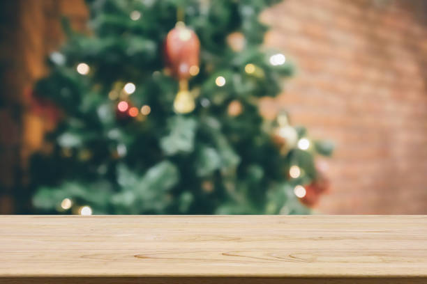 istock Empty wood table top with abstract blur decorated Christmas tree with baubles New Year holidays background for mockup product display 1271233180