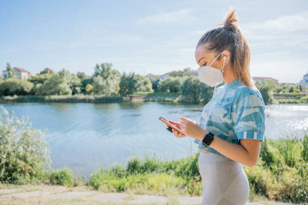 istock Woman wearing mask with sportswear doing exercise 1271237309