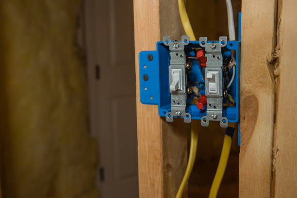 istock Blue Plastic Electical Box with Off and On Switch on new home construction framing 1271242532