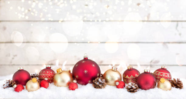 istock Christmas Baubles on a White Wood Background 1271242800