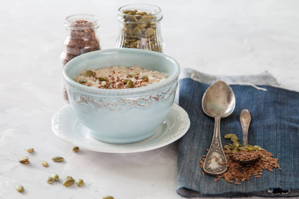 istock porridge with flax seeds in a bowl on a table, selective focus 1271249247