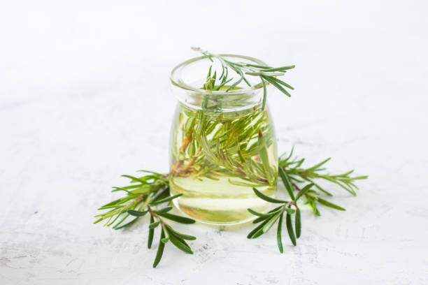 istock oil with rosemary in a jar on a table, selective focus 1271249970