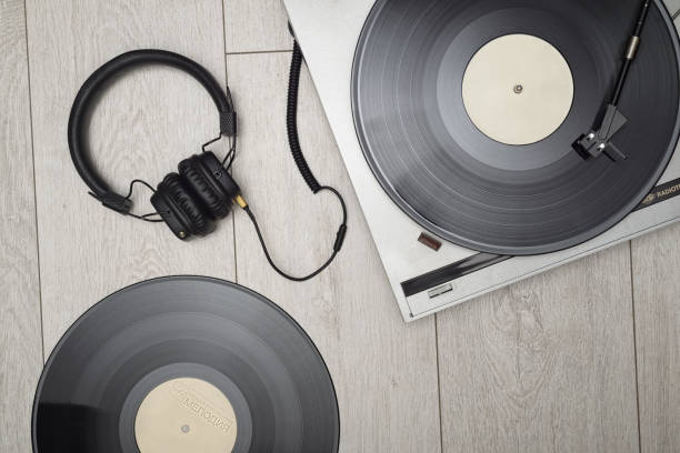 istock Vinyl player with long play or LP records and headphones. 1271255111