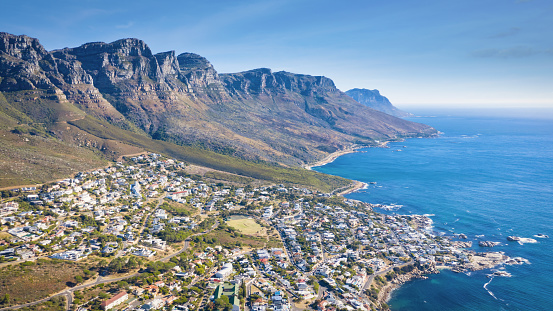 Aerial Panorama - Drone Point of View - towards Camps Bay under Table Mountain Range. Camps Bay is a famous suburb of the city of Cape Town underneath the Table Mountain Range. Camps Bay, Cape Town, South Africa, Africa