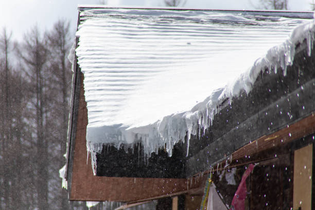 istock A roof with snow and icicles 1271258953