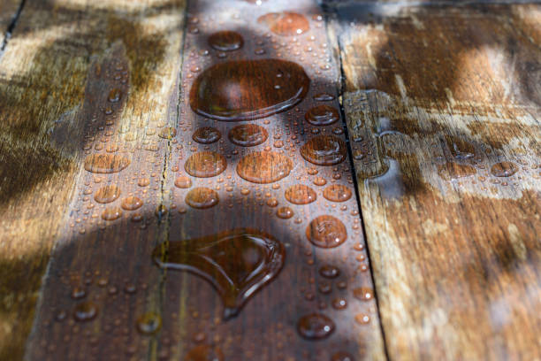 Floor boards with rain drops. Floorboards treatments and deck protect. Impregnation for protection from water. Natural aging of wood