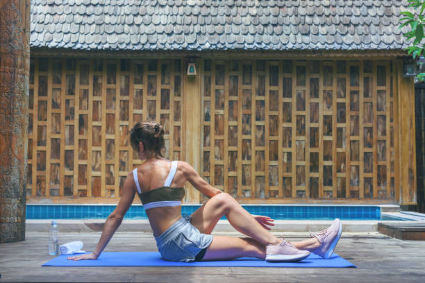 istock Young fit woman doing yoga stretching exercise 1271262074