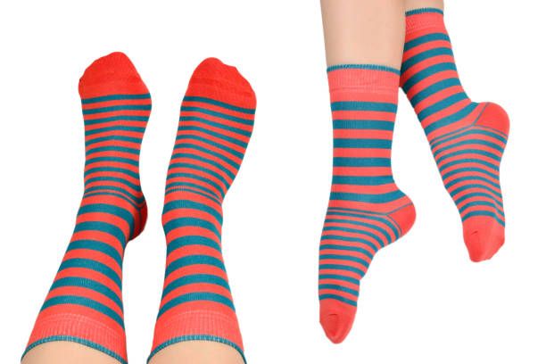 istock Woman in orange socks isolated on white background. 1271262931