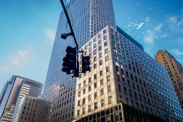 istock Looking up at Manhattan intersection wit h straffic lights at 42nd street and 3rd ave business buildings and skyscrapers 1271263019