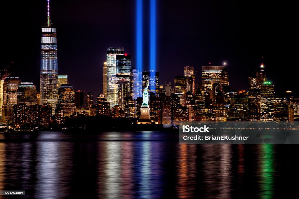 9/11 Memorial Beams with Statue of Liberty and Lower Manhattan 911 Remembrance Stock Photo