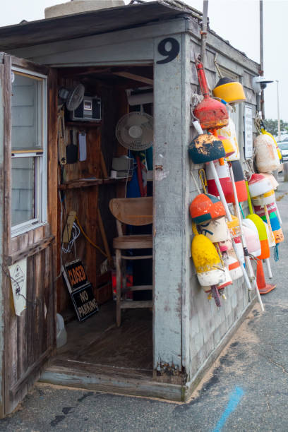 istock Old beach cabin with boat floating devices on exterior wall as decorations 1271263116