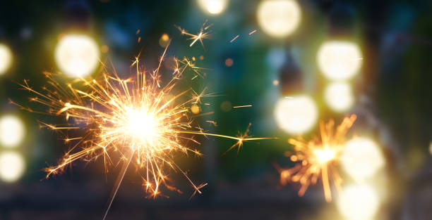 istock Happy New Year, Burning sparkler with bokeh light background 1271263964
