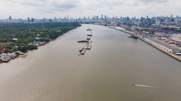 istock Aerial view cargo ship on Chao Phraya river and city 1271264942