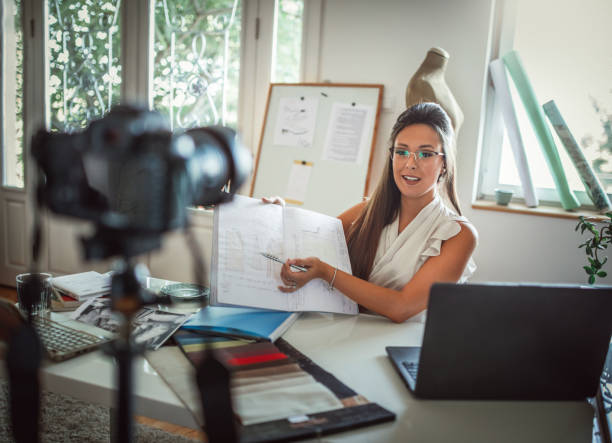 istock Group of young business people working and communicating while sitting at the office 1271268463