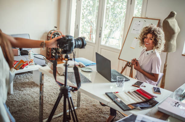 istock Group of young business people working and communicating while sitting at the office 1271269289