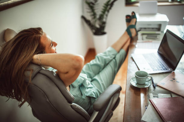 istock Group of young business people working and communicating while sitting at the office 1271269315