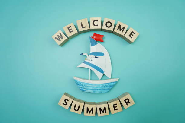 istock Welcome Summer message alphabet letter with sailboat on blue background 1271269318