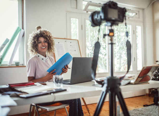 istock Group of young business people working and communicating while sitting at the office 1271269390