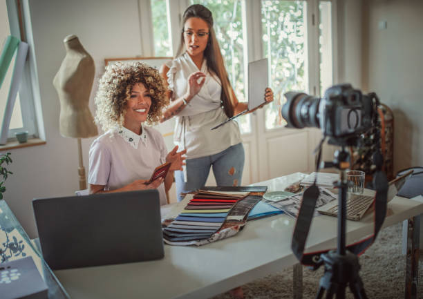 istock Group of young business people working and communicating while sitting at the office 1271269392
