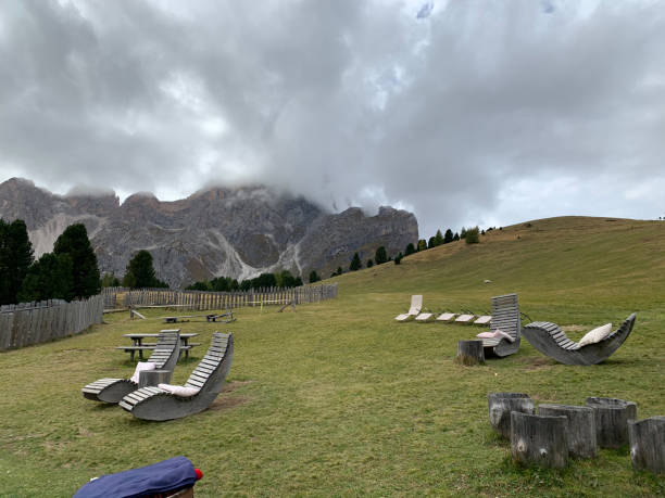 istock Clouds over grassland in the Alps 1271270544