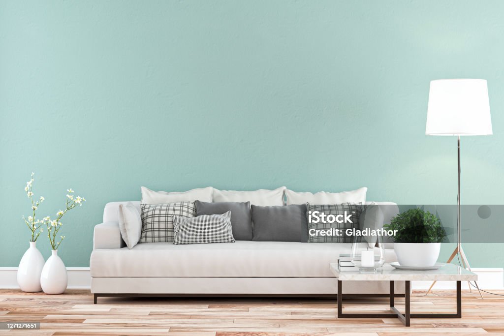 Elegant living room with sofa whole view - colored wall background Elegant living room with white sofa on hardwood floor in front of mint green wall background and copy space. 3D rendered image. Sofa Stock Photo
