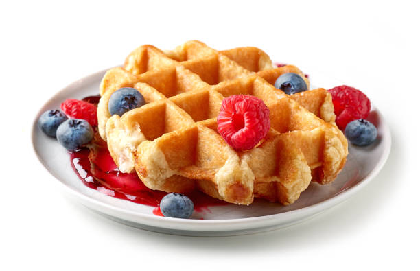 istock belgian waffle with fresh berries on plate isolated on white background 1271274145