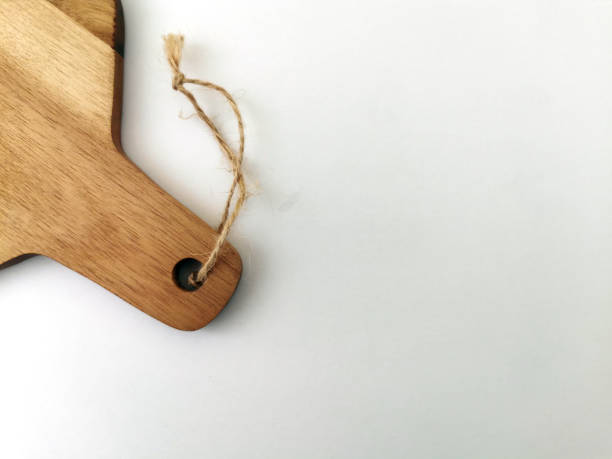 istock Wooden Chopping board, isolated on white with a copy space 1271274436