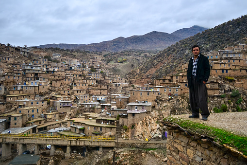 Palangan, Iranian Kurdistan - November 15, 2013: Environmental portrait of Kurdish man in old Palangan stony muntain village