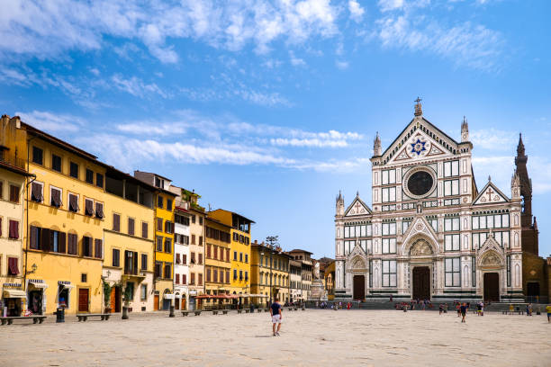 The beautiful facade of the Basilica of Santa Croce in the historic center of Florence Florence, Italy, August 11 -- The beautiful facade of the Basilica of Santa Croce, in the heart of the historic center of Florence. This neo-Gothic Franciscan Catholic church is famous for Giotto's frescoes and for guarding the tombs of Michelangelo Buonarroti and the astronomer Galileo Galilei. Image in high definition format. piazza di santa croce stock pictures, royalty-free photos & images