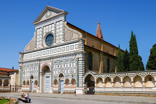 Florence, Italy, August 12 -- The beautiful facade of the Basilica of Santa Maria Novella, in the heart of the historic center of Florence. This ancient Florentine church, one of the most loved and visited in the city of lily, is famous for being the seat of the Dominican friars order, whose construction in Gothic style began in 1279. The facade is the work of the architect Leon Battista Alberti, masterpiece of the Florentine Renaissance style. The cathedral is decorated with numerous frescoes by great artists, such as Giotto, Domenico Ghirlandaio, Masaccio, Filippino Lippi. Image in high definition format.