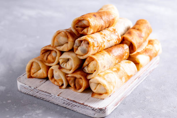 istock Rolled pancakes with cottage cheese and raisins 1271276925