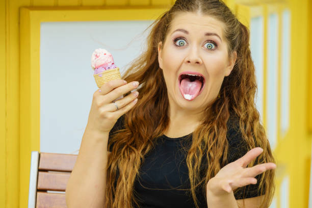 istock Young woman eating ice cream 1271278062