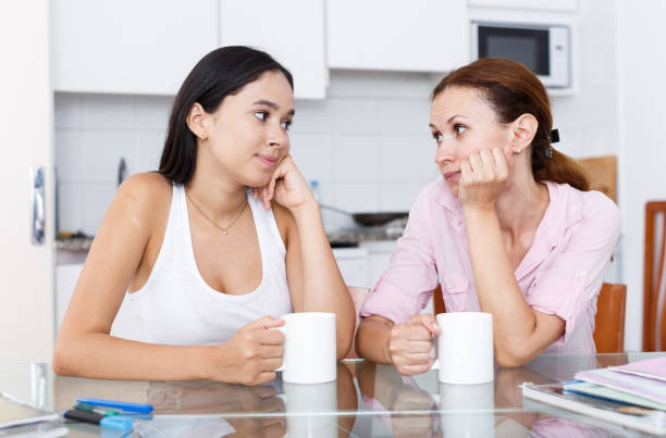 istock Mother and daughter talking 1271278568