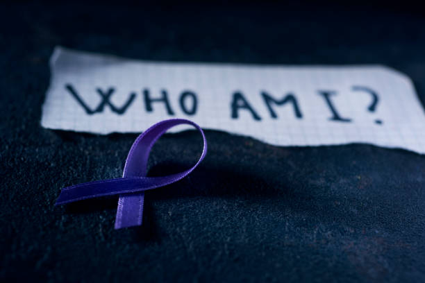 istock alzheimers awareness ribbon and question who am I 1271279801