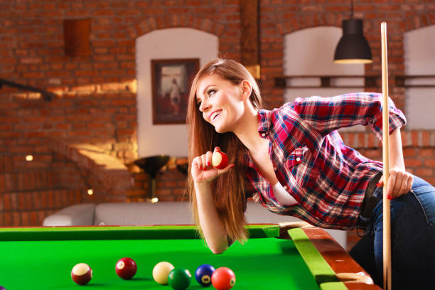 young woman having fun with billiard. - snooker table imagens e fotografias de stock