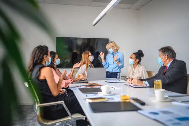 Photo of Executives Wearing Surgical Masks in Time of COVID-19