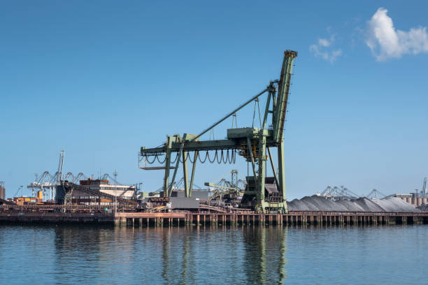 istock Type of cargo terminal and cranes, berths for transshipment of bulk cargo, iron ore and coal 1271281421