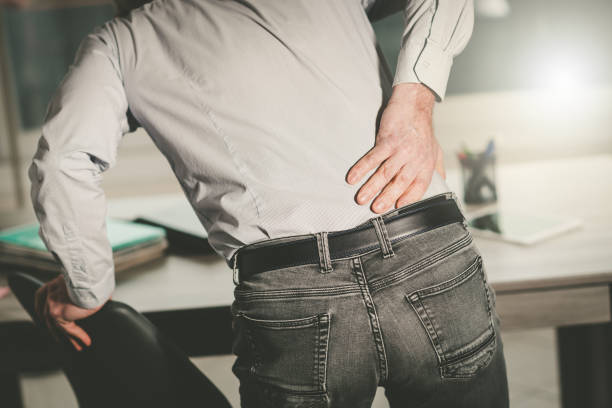 istock Businessman suffering from back pain, light effect 1271281626