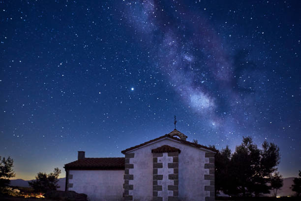 istock View of the Milky Way over a small chapel. Concept science 1271282220