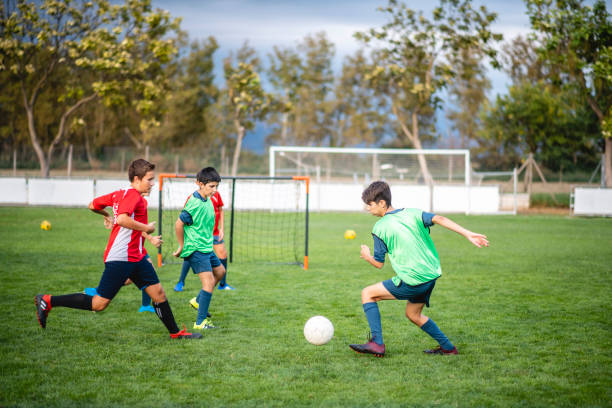istock Young Male Footballers Playing Practice Match 1271284994