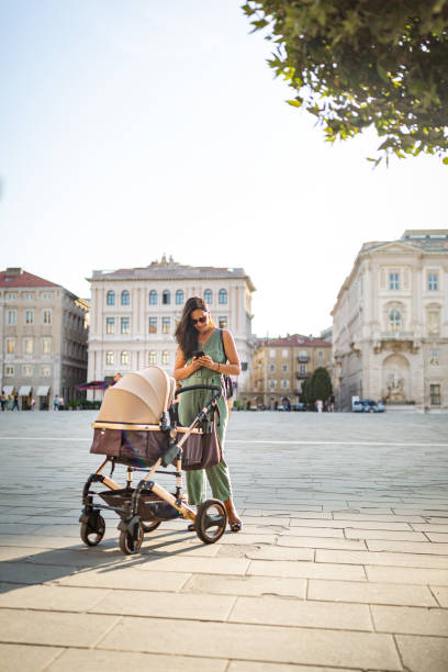 istock Young Italian woman walking with her baby 1271286310