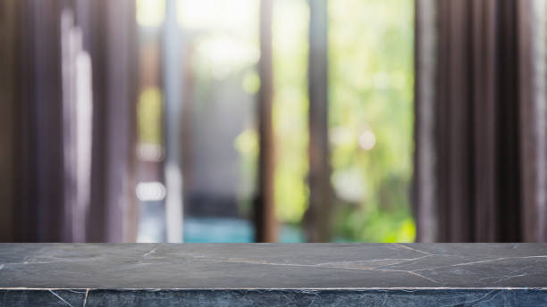 istock Empty black marble stone table top and blurred home interior with curtain window background. - can used for display or montage your products. 1271286487