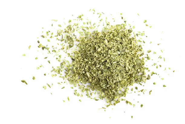 Pile of dry oregano herb isolated on white background. Top view.